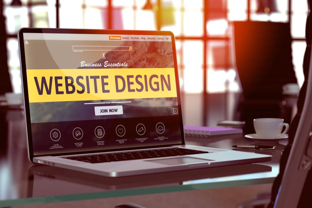 Modern laptop screen showing affordable pay monthly websites for small businesses